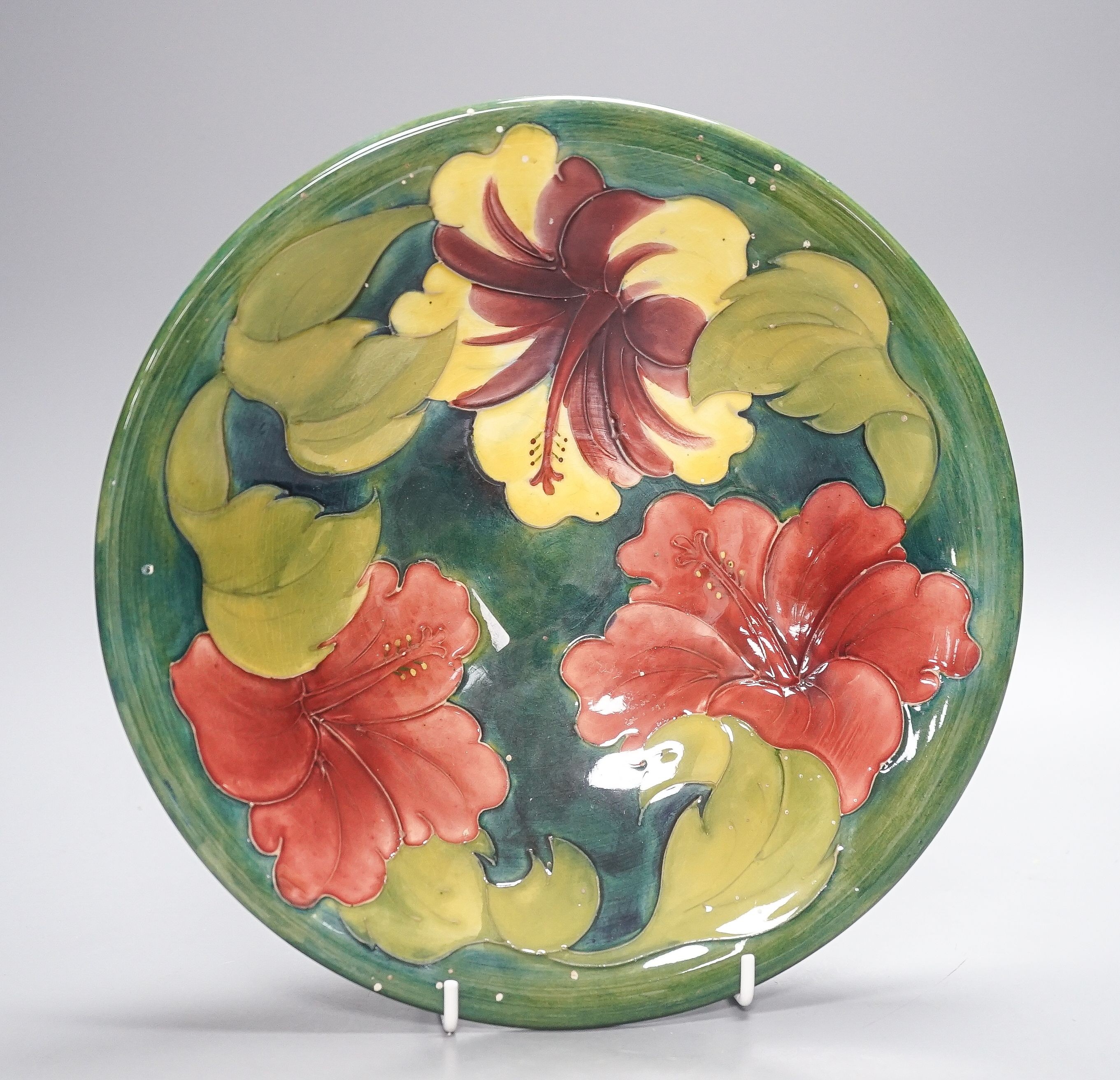 A Moorcroft hibiscus pattern dish 25cm